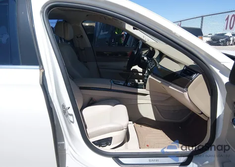 2012 BMW 750Li z USA, uszkodzony, nr VIN WBAKB8C50CC964431